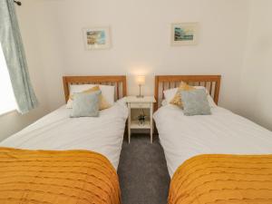 Postel nebo postele na pokoji v ubytování Woolley Lodge + 42 fotografií