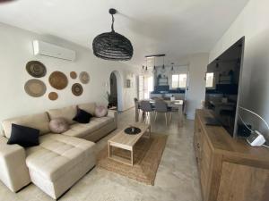 a living room with a couch and a table at Daenerys - AzulenaCalpe in Calpe