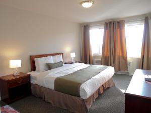 เตียงในห้องที่ Beausejour Hotel Apartments/Hotel Dorval