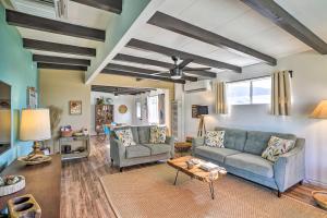 a living room with two couches and a table at Pet-Friendly Home with Patios and Private Hot Tub! in Twentynine Palms