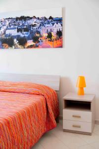 A bed or beds in a room at B&B Il Nido sui Trulli