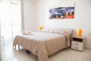 A bed or beds in a room at B&B Il Nido sui Trulli