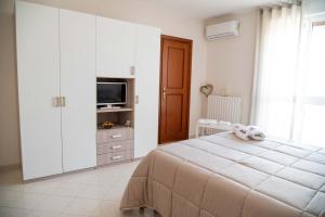A bed or beds in a room at B&B Il Nido sui Trulli