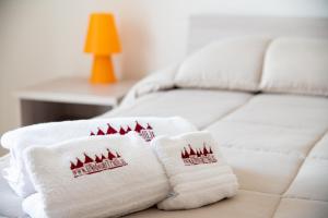 A bed or beds in a room at B&B Il Nido sui Trulli