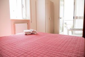 A bed or beds in a room at B&B Il Nido sui Trulli