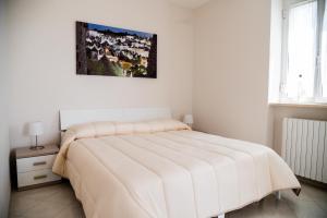 A bed or beds in a room at B&B Il Nido sui Trulli
