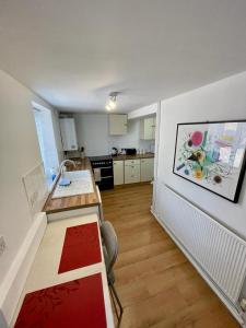 a kitchen with a desk and a counter in a room at Number 8 Clandown in Radstock