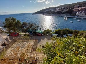 a view of a large body of water with boats at Apartman Aurora in Čara