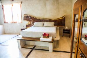 Postel nebo postele na pokoji v ubytování La Casa de Mia Holbox
