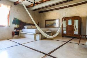 Postel nebo postele na pokoji v ubytování La Casa de Mia Holbox