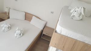 Postel nebo postele na pokoji v ubytování Casa Nicholas