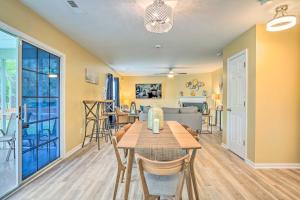 a dining room with a table and a living room at Summerville Family Home about 20 Mi to Charleston in Summerville +34 photos