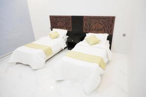 Postel nebo postele na pokoji v ubytování Al Khuzama Resort