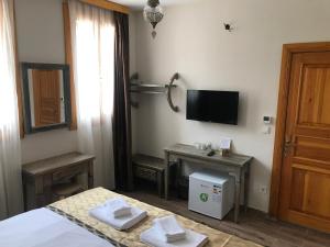 A television and/or entertainment centre at Green Mansion