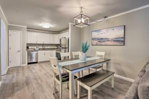 a dining room and kitchen with a table and chairs at Hilton Head Island Condo with Resort Amenities! in Hilton Head Island