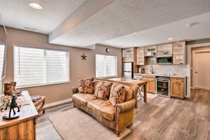 a living room with a couch and a kitchen at Beautiful and Updated Apartment in Heber City! in Heber City