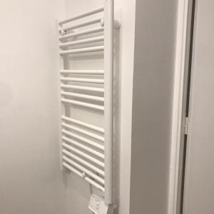a refrigerator with a white radiator in a room at Escale à Disneyland Paris in Montévrain