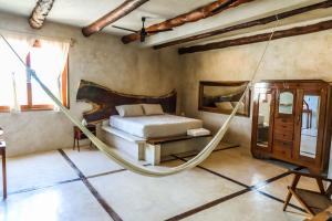 Postel nebo postele na pokoji v ubytování La Casa de Mia Holbox