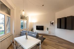 a living room with a couch and a table at Matilde Modern apartment-Rental in Rome in Rome