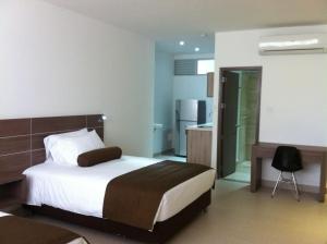 Ένα ή περισσότερα κρεβάτια σε δωμάτιο στο Hausen Hotel - Suites