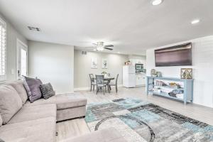 a living room with a couch and a table at Gilbert Apartment with Grill, Fire Pit and Pool Access in Gilbert