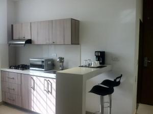 Η κουζίνα ή μικρή κουζίνα στο Hausen Hotel - Suites