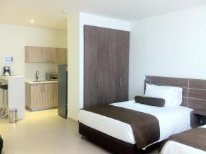 Ένα ή περισσότερα κρεβάτια σε δωμάτιο στο Hausen Hotel - Suites