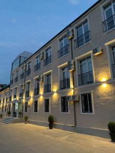 a large building with lights on the side of it at Hotel Sani Kutaisi in Kutaisi