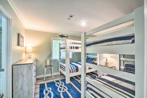 a bedroom with two bunk beds and a desk at Sunny Edisto Island Duplex - Half Mile to Beach! in Edisto Island +28 photos