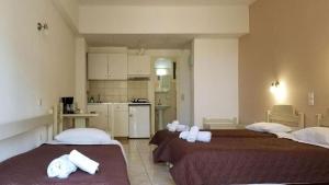 Postel nebo postele na pokoji v ubytování MIRABELLO HOTEL APARTMENTS