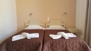 Postel nebo postele na pokoji v ubytování MIRABELLO HOTEL APARTMENTS