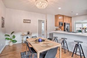 a kitchen and dining room with a table and chairs at Charming Downtown Home with Updated Interior! in Oklahoma City