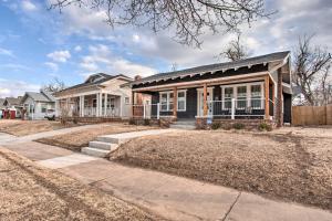 a house with a porch and a fence at Charming Downtown Home with Updated Interior! in Oklahoma City