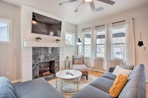 a living room with a couch and a fireplace at Charming Downtown Home with Updated Interior! in Oklahoma City