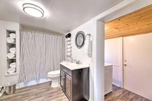 a bathroom with a sink and a toilet and a shower at Idyllic Fayetteville Home - Walk to UA Campus! in Fayetteville +20 photos