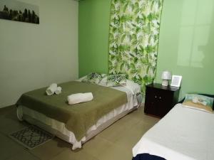 Tempat tidur dalam kamar di Casa Hostal Bouvá