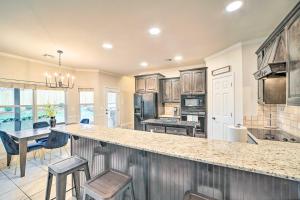 a kitchen with a large island with a counter top at Pet-Friendly Tulsa Escape with Private Hot Tub! in Tulsa