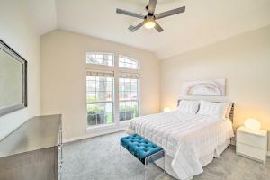 a bedroom with a bed and a ceiling fan at Pet-Friendly Tulsa Escape with Private Hot Tub! in Tulsa +35 photos