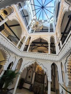 a building with a ceiling with a chandelier at Riad El Palacio & Spa Chaouen in Chefchaouene