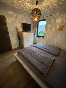 TV a/nebo společenská místnost v ubytování Gästezimmer Melina am Nürburgring