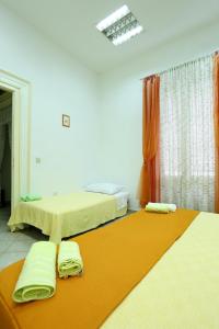 Postel nebo postele na pokoji v ubytování Apartment City Center Dragica