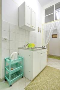 Kuchyň nebo kuchyňský kout v ubytování Apartment City Center Dragica