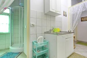 Koupelna v ubytování Apartment City Center Dragica