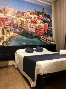 Ένα ή περισσότερα κρεβάτια σε δωμάτιο στο Albergo Corvetto Corso Lodi