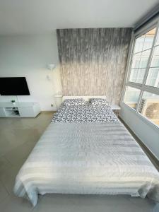 Postel nebo postele na pokoji v ubytování Apartamento La Torre 1337 Precioso, moderno y con piscina