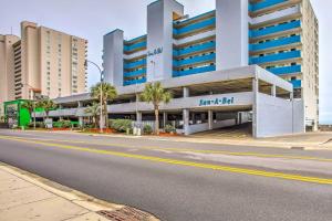an empty street in front of a building at Cozy Coastal Condo with Airy Oceanfront Balcony in Myrtle Beach
