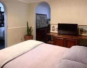 Кровать или кровати в номере Mansão Morumbi 91