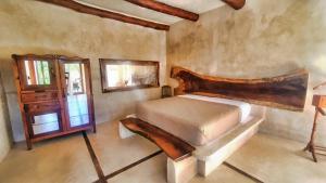 Postel nebo postele na pokoji v ubytování La Casa de Mia Holbox