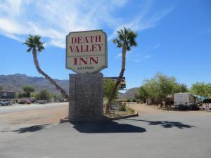 a sign for a death valley inn on a street at Death Valley Inn & RV Park in Beatty