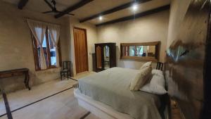 Postel nebo postele na pokoji v ubytování La Casa de Mia Holbox